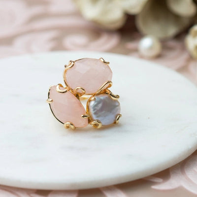 Two rose quartz stones accented ring, with a freshwater pearl, all in a gold border. - TMV_RG20