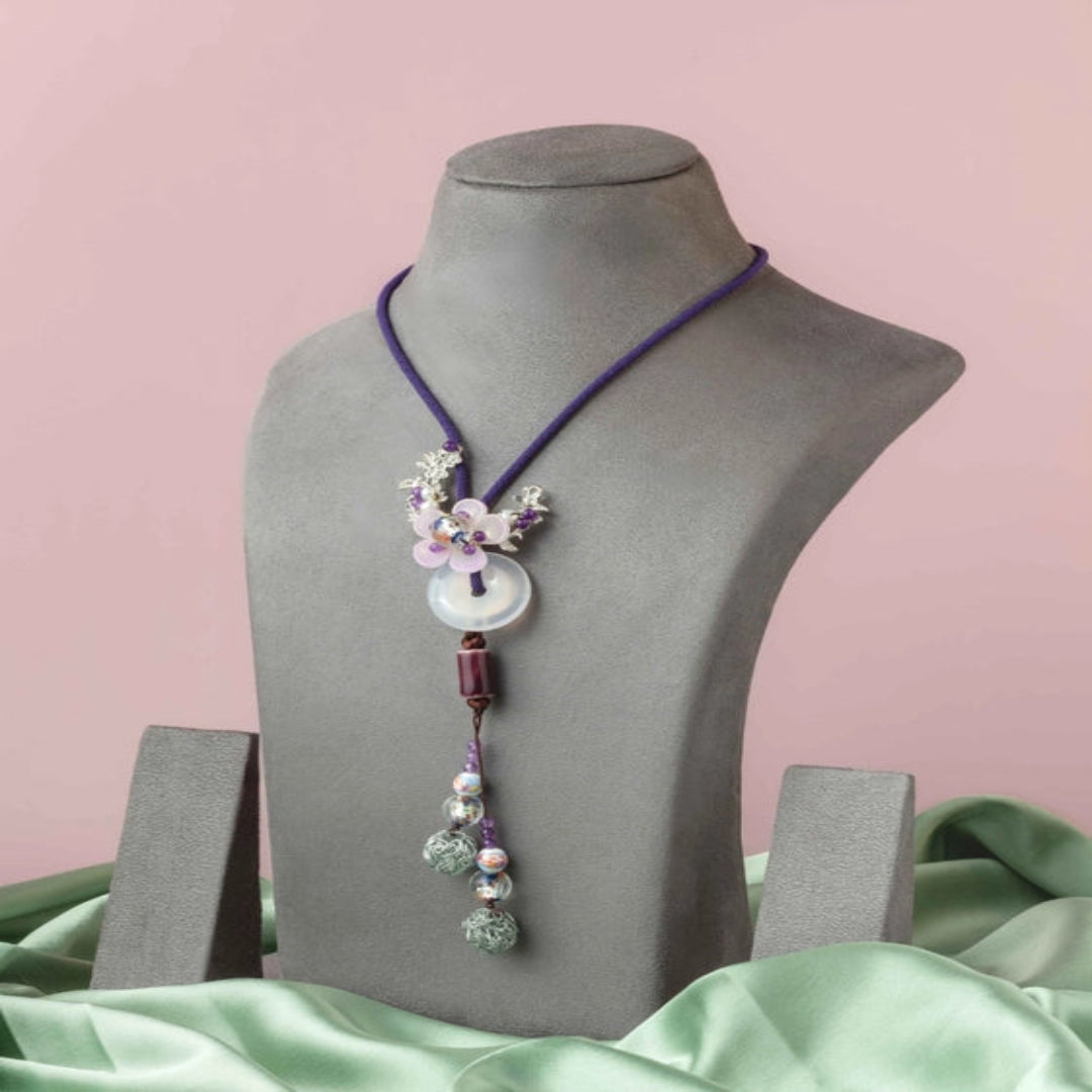 Graceful purple thread with a delicate floral pendant. - TMV_NP2