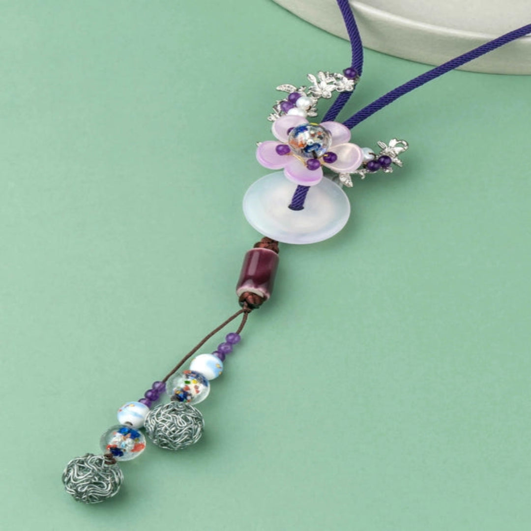 Graceful purple thread with a delicate floral pendant. - TMV_NP2