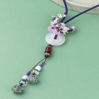 Graceful purple thread with a delicate floral pendant. - TMV_NP2