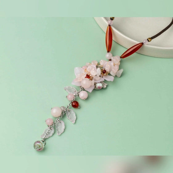 Rustic beads and a lovely pink flower on a brown thread. - TMV_NP6