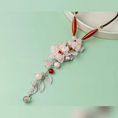 Rustic beads and a lovely pink flower on a brown thread. - TMV_NP6