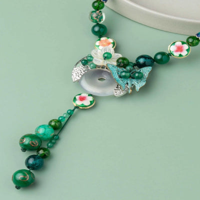 Refreshing green thread Neckpiece, with a charming butterfly and dangling embellishment. - TMV_NP5