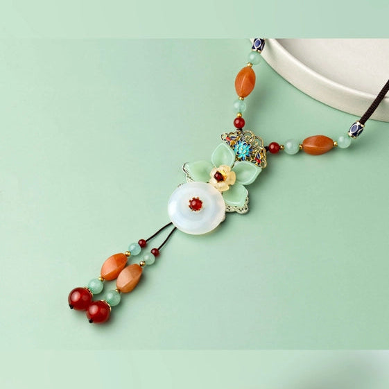 Unique brown thread Neckpiece, with a green flower and a hanging detail. - TMV_NP7