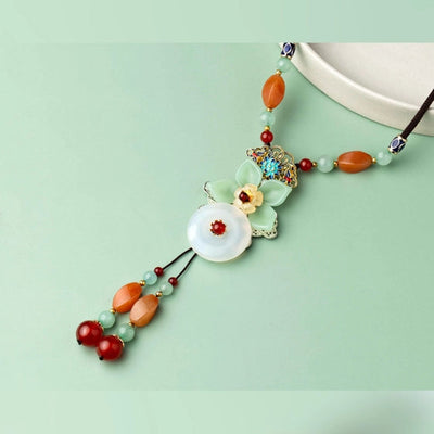 Unique brown thread Neckpiece, with a green flower and a hanging detail. - TMV_NP7