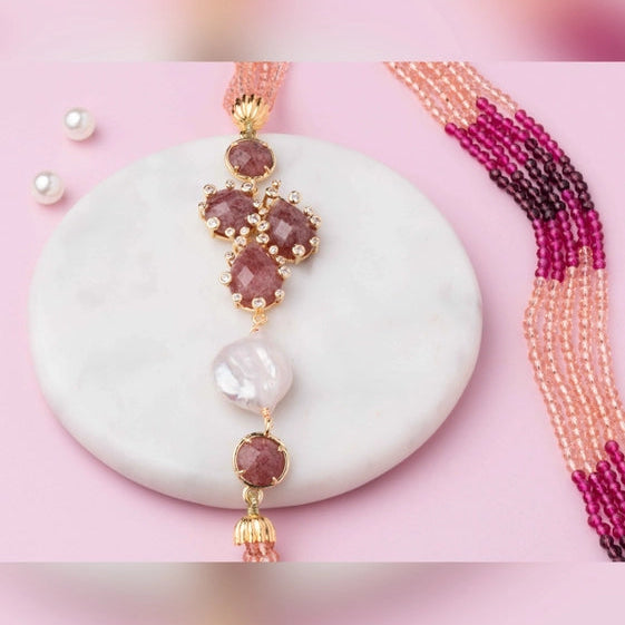 Pretty pink shaded beads strung together with an agate pendant and diamonds. - TMV_NP22