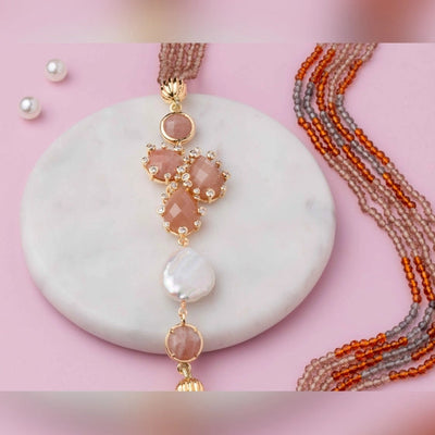 Rustic shades of rust, grey, and orange beads with an agate pendant. - TMV_NP23