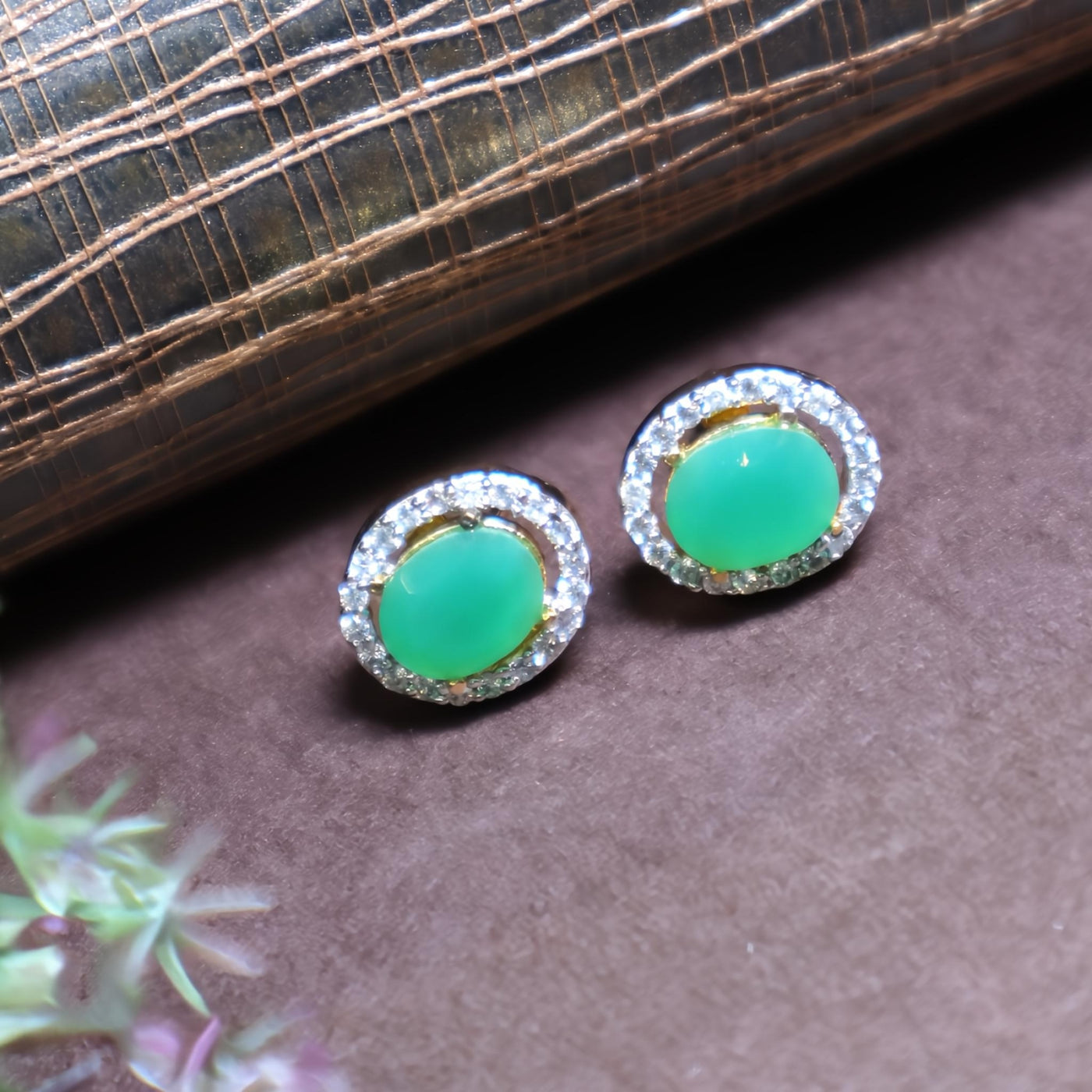 Gold-Plated Oval Green Stone Stud Earrings with Halo Design - SIA449314