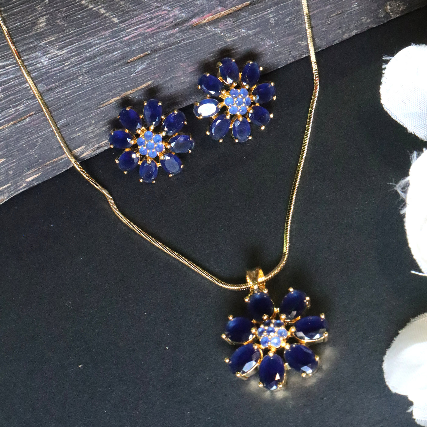 Gold-Toned Floral Pendant Set with Dark Blue Stones - SIA453095