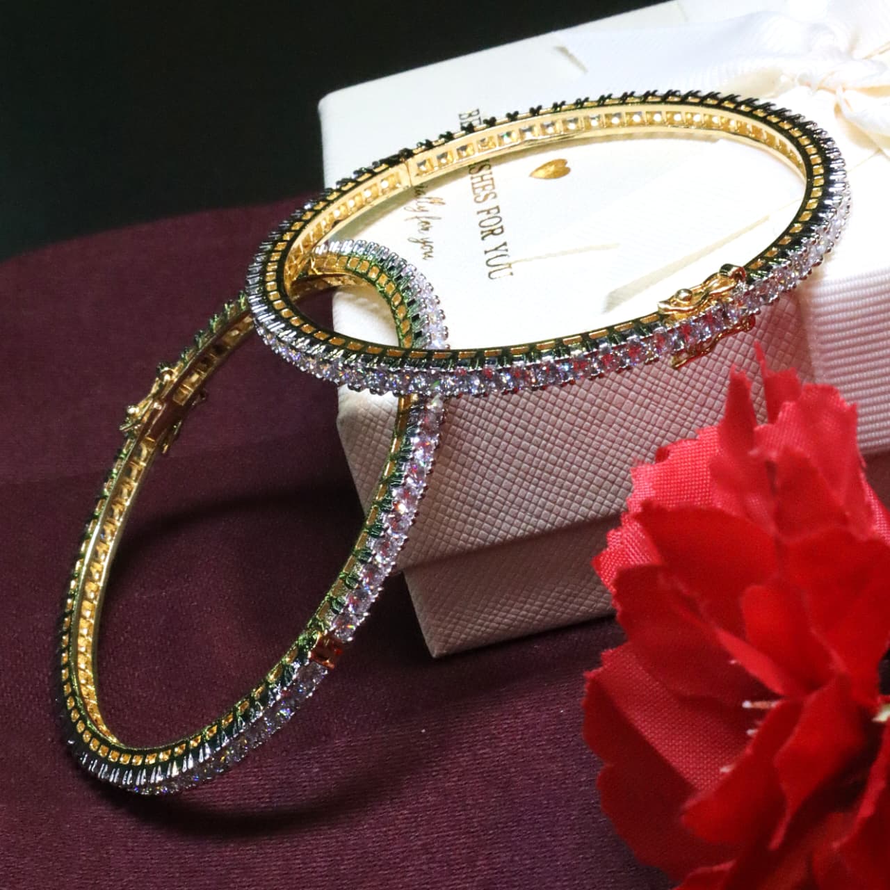 Radiant gold bangles adorned with sparkling stones — a perfect blend of elegance and luxury - SIA453932
