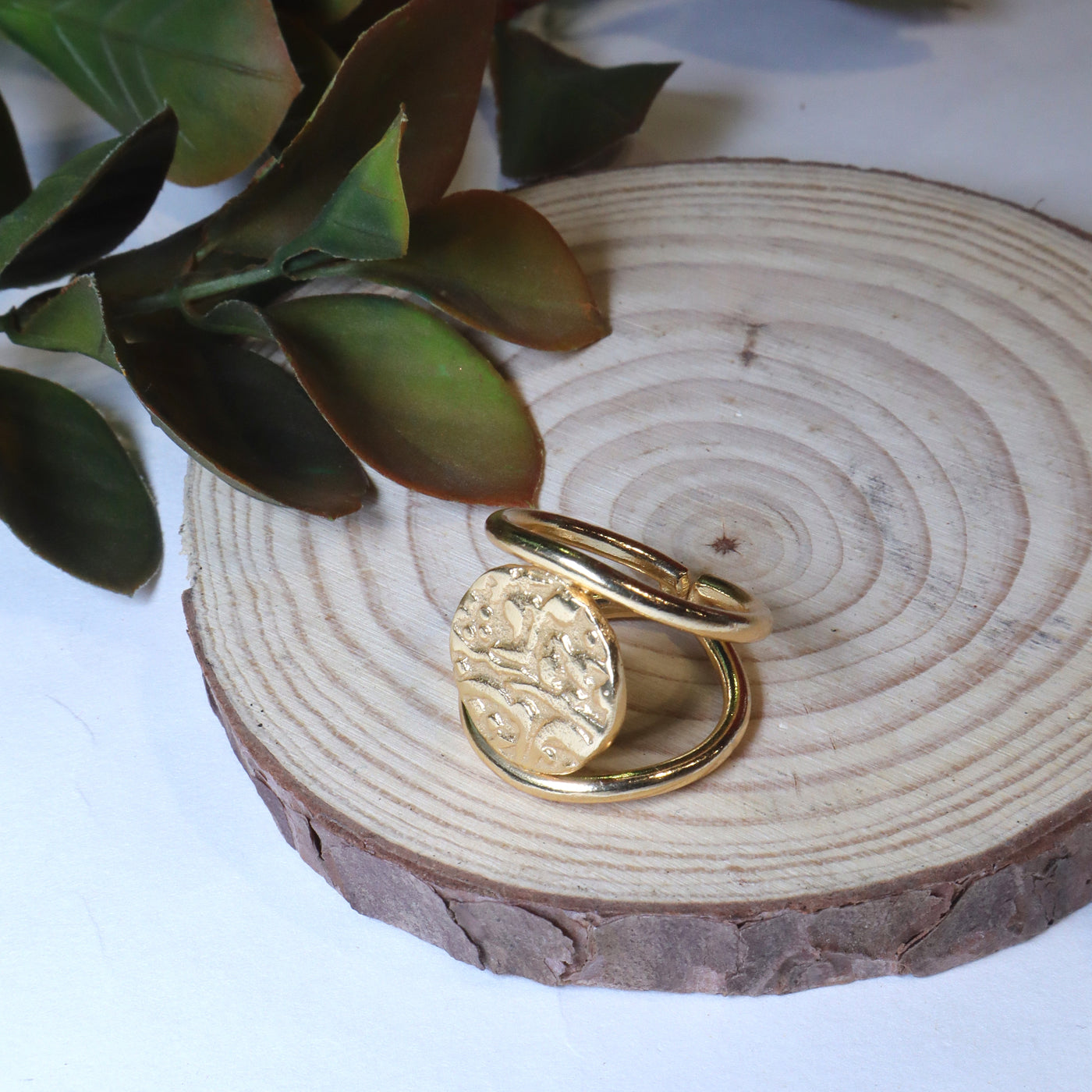 Gold-Toned Spiral Wrap Ring with Embossed Round Accent. - SIA456571